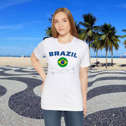 White woman wearing a white cotton T-shirt featuring the word 'Brazil' and its rounded flag, in a beach background