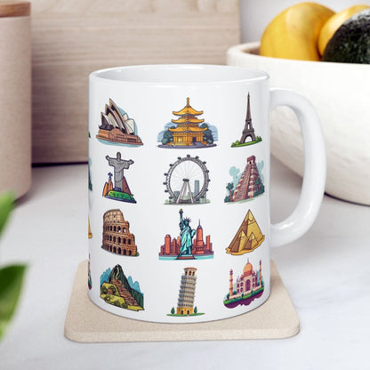 white ceramic coffee mug featuring famous world travel landmarks, on a table with white cloth and other decoration