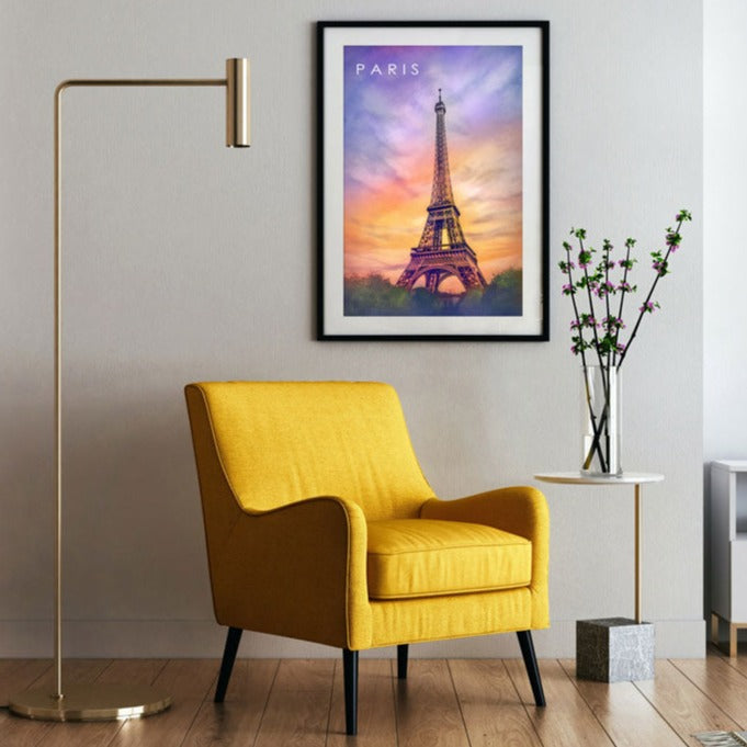 Black-Framed Sunset Sky Eiffel Tower Poster on a light gray wall in a room with a yellow sofa and other decoration