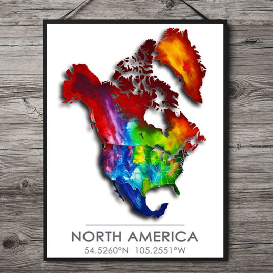 Black-Framed Poster of a colorful map of North America hanging on a dark gray wood wall