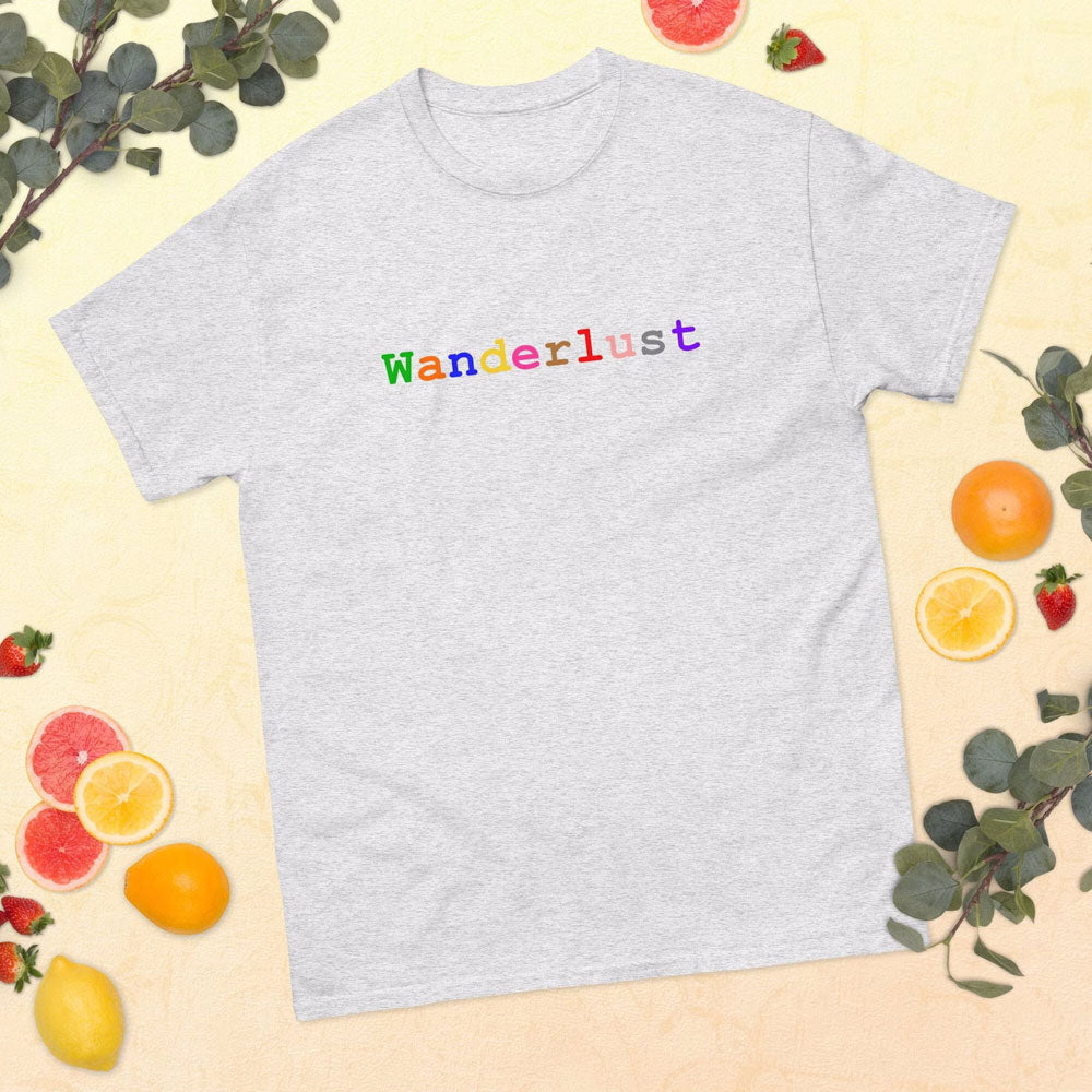 Light gray cotton t-shirt adorned with the word 'Wanderlust', set against a backdrop of soft yellow with a charming arrangement of fruits and lush greenery