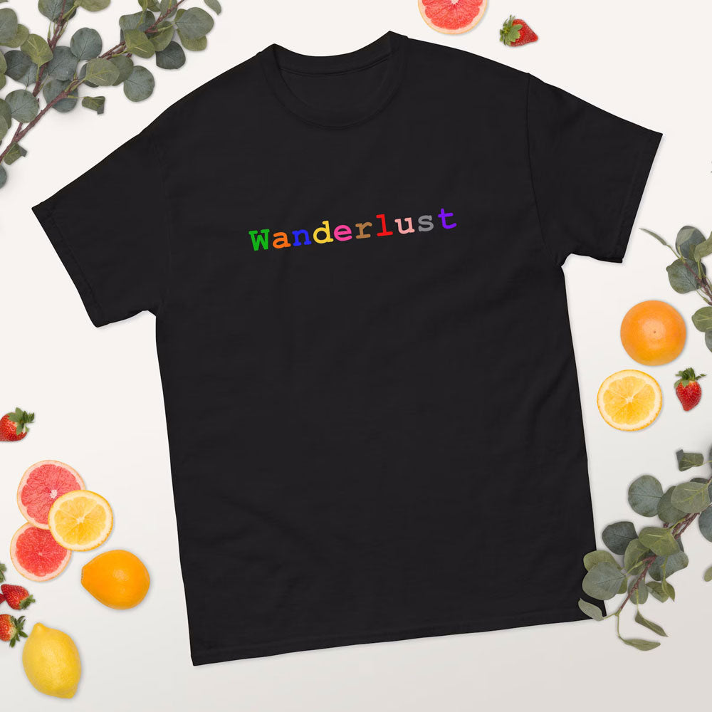 Black cotton t-shirt adorned with the word 'Wanderlust', set against a white backdrop with a charming arrangement of fruits and lush greenery