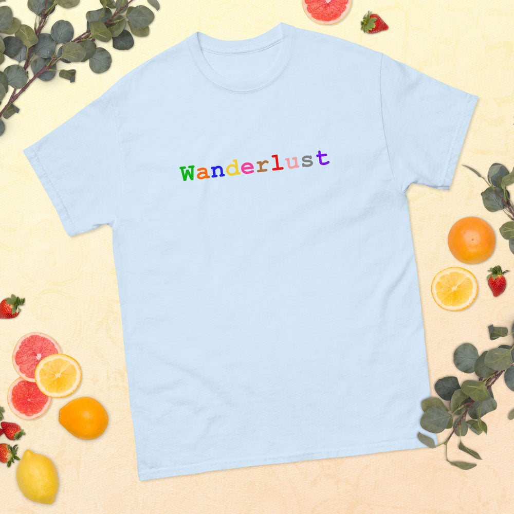 Light blue cotton t-shirt adorned with the word 'Wanderlust', set against a backdrop of soft yellow with a charming arrangement of fruits and lush greenery