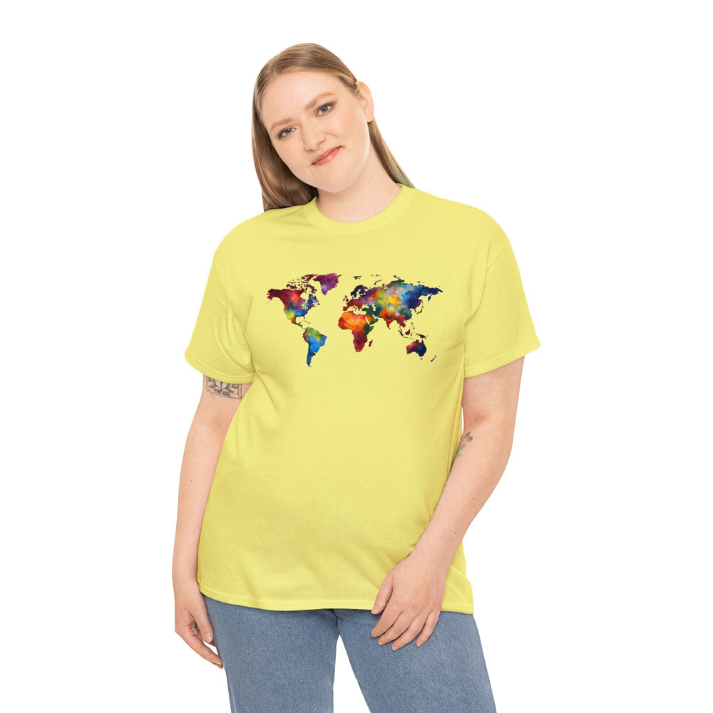 Young white lady wearing a yellow t-shirt featuring a multicolored world map graphic and jeans pants
